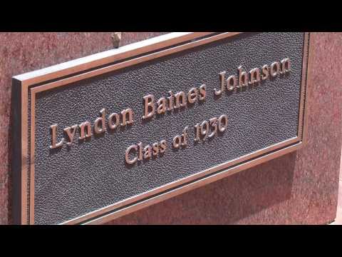 picture of Lyndon Baines Johnson's nameplate under the statue of him on Texas State campus