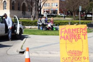 A Farmer's Market sign.