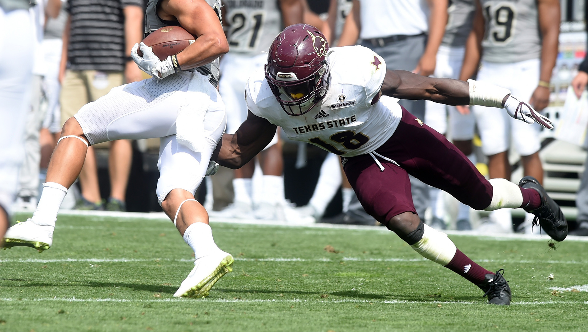 Texas State University's Linebacker Frankie Griffin dives for a tackle