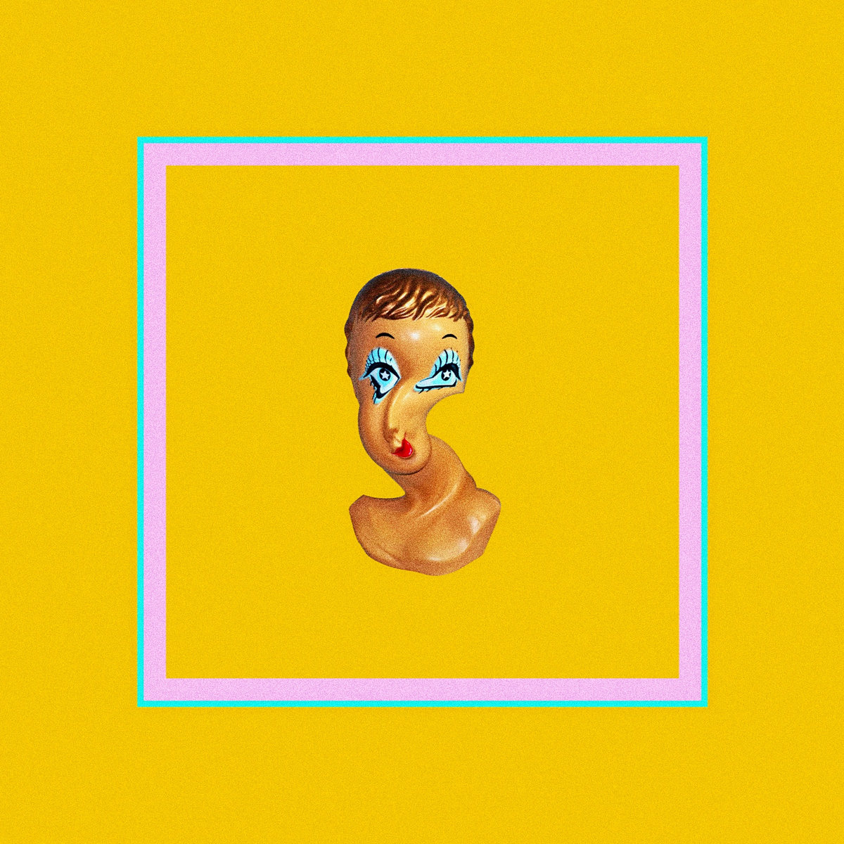 A twisted face sculpture on a yellow background.