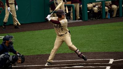 Player in batters box about to swing.