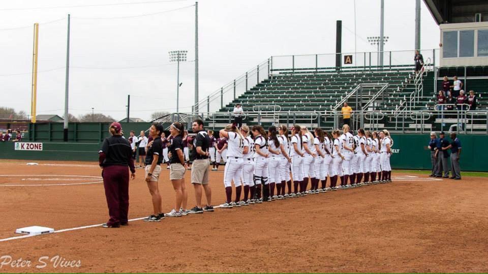 Texas State Softball stands for the pledge before game