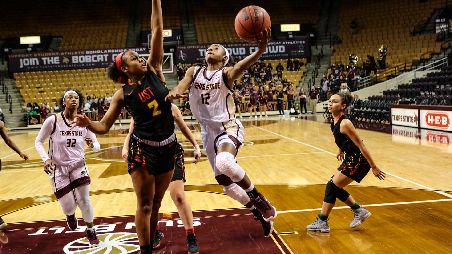 Dabrasia Baty drives to the basket for a layup against St. Thomas inside Strahan Arena.