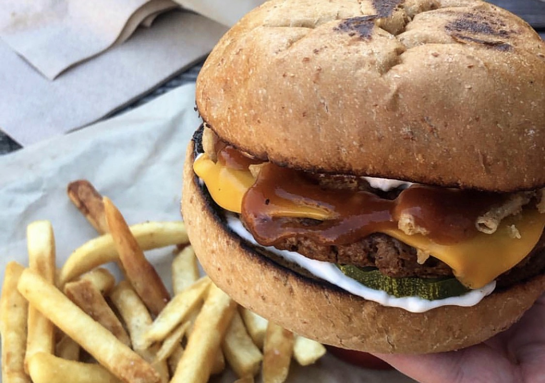 A vegan BBQ burger and fries at Buzz Mill..