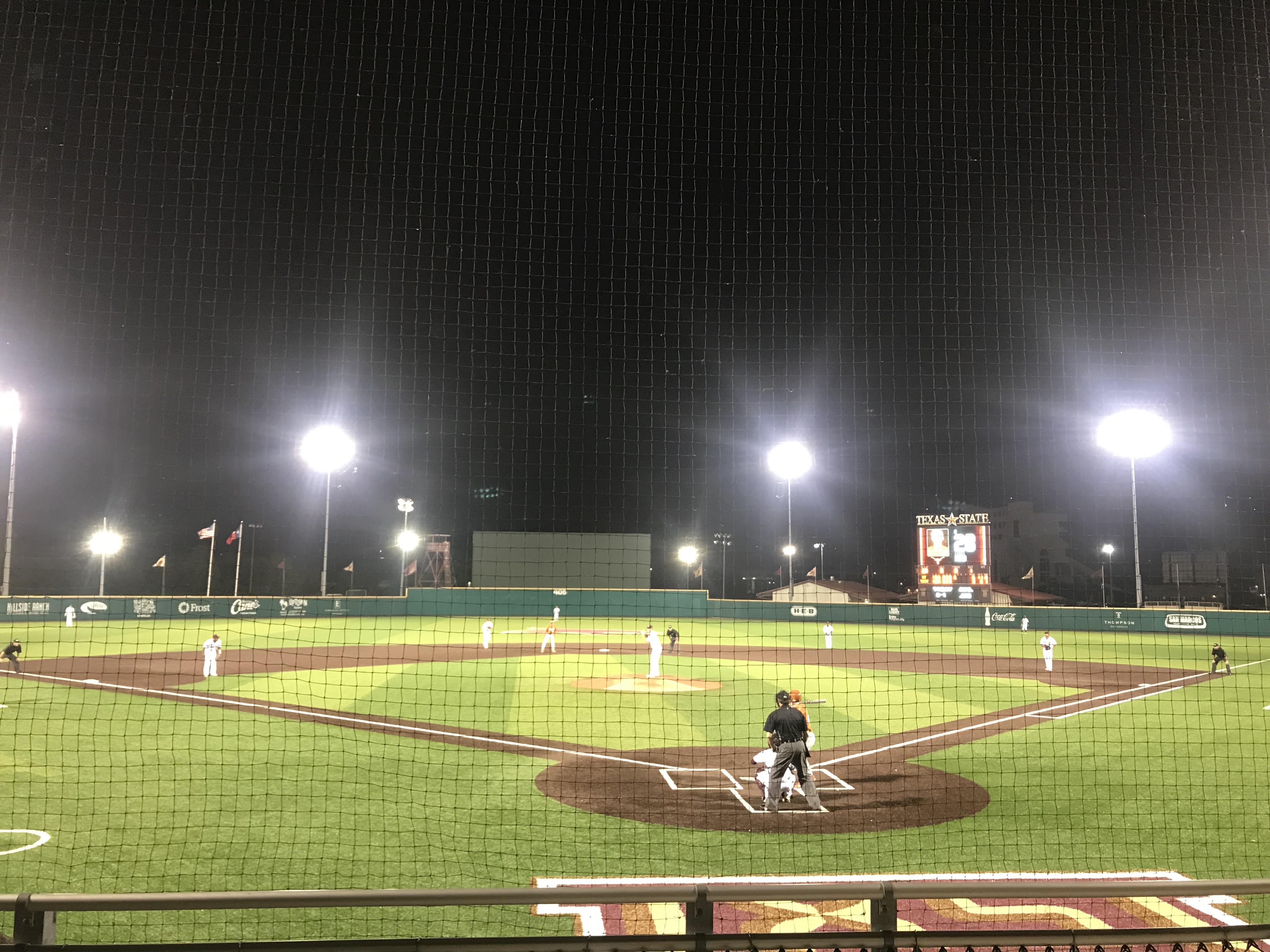 Bobcat Baseball field under the lights with players at every position.