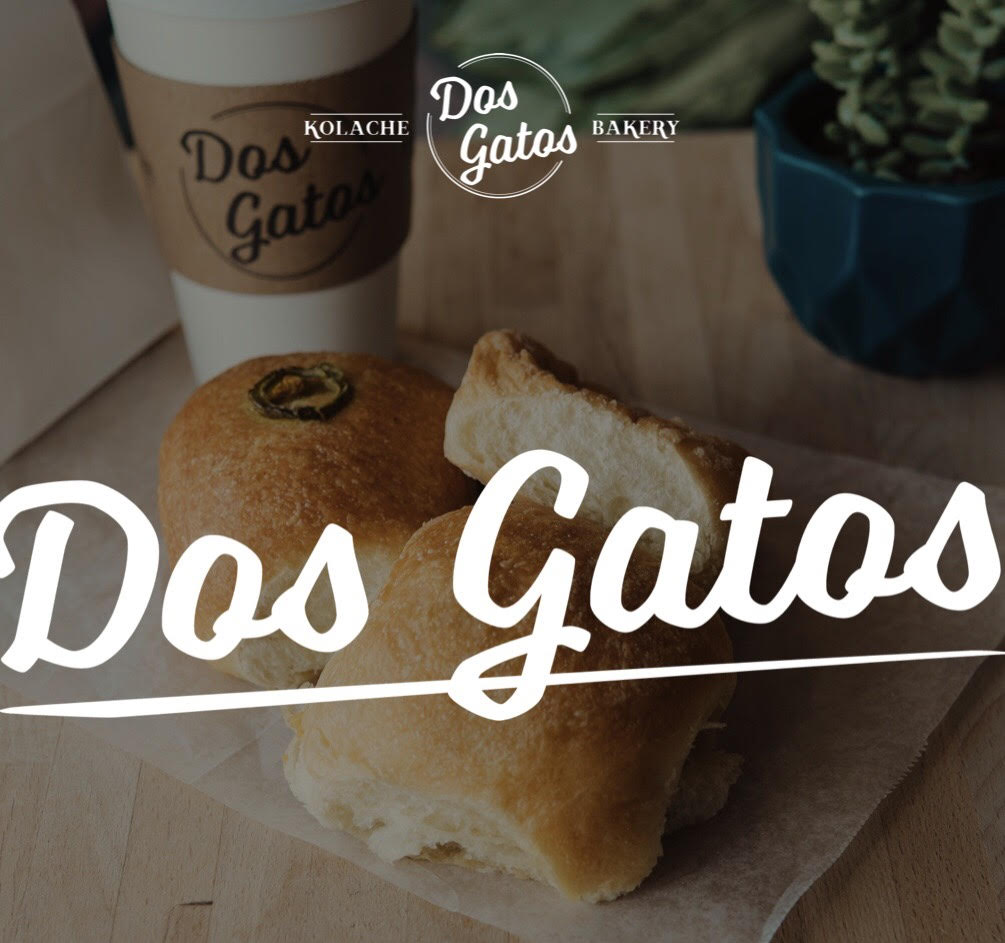 The words Dos Gatos in white lettering and a small Dos Gatos logo over a picture of kolaches and coffee.