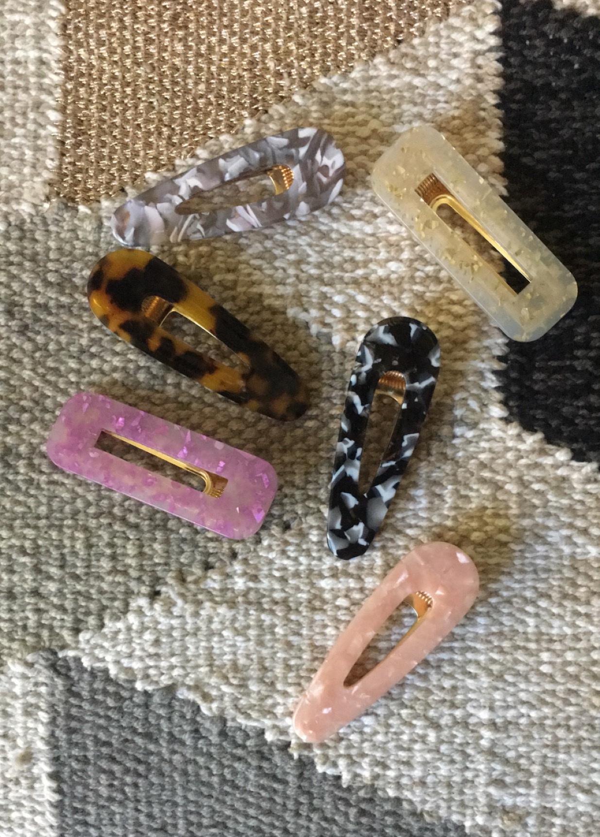 Hair clips sitting on a background. 