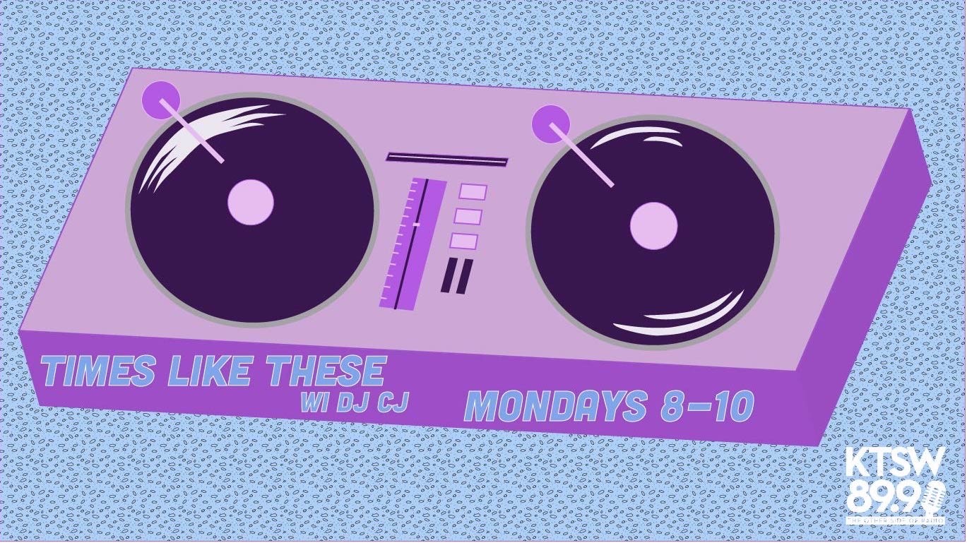 Purple Record spin board with 1 record on either side of it in black. Light Blue background with navy dots. Times like these with DJ CJ Mondays 8-10 on the fron of the record board with KTSW logo in the bottom right.