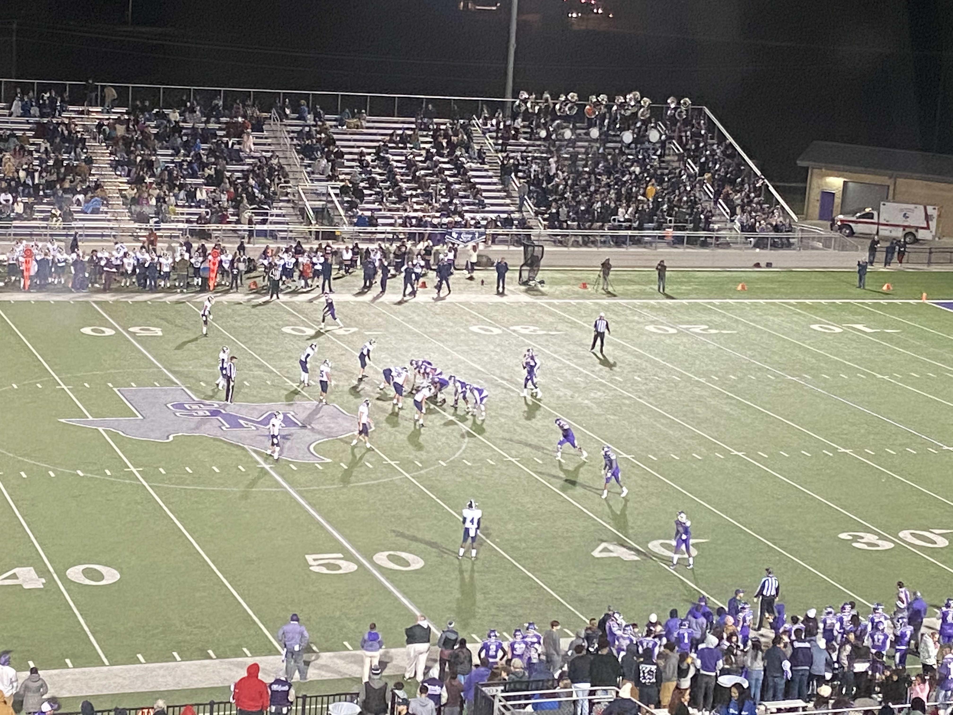 San Marcos is on offense running a play against the Smithson Valley defense