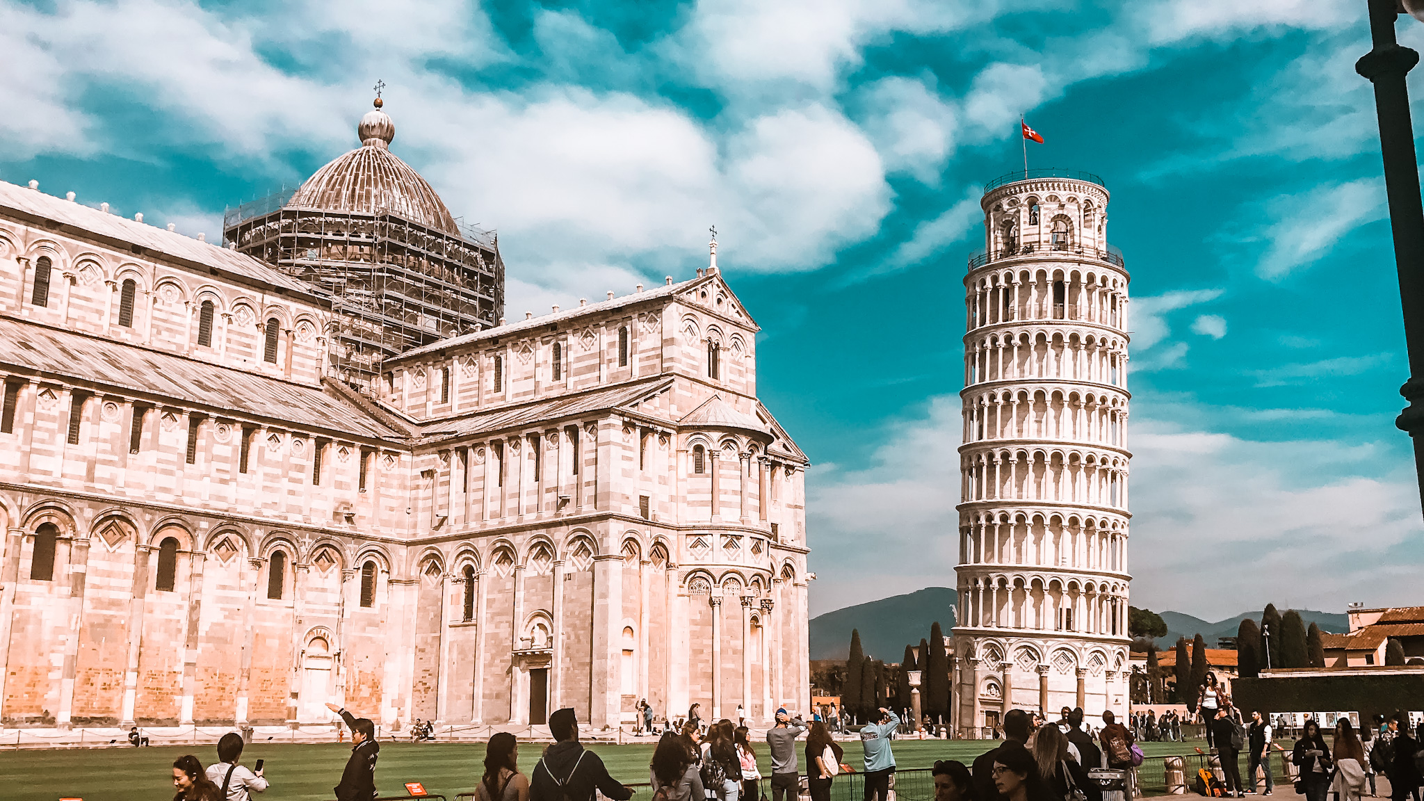 The Leaning Tower of Pisa and the Cathedral of Pisa gather large crowds around it