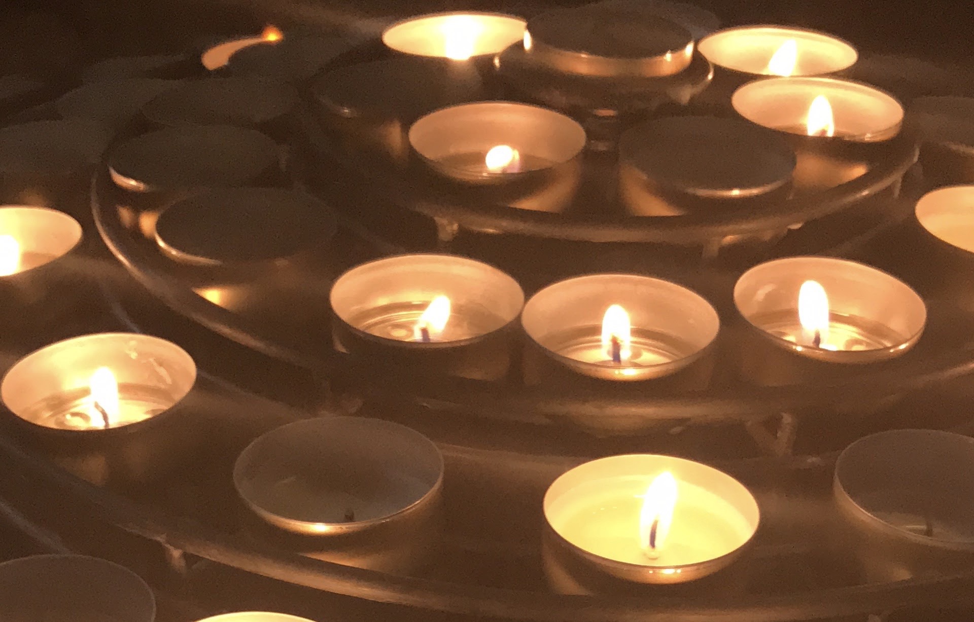 small candles stacked on a rack