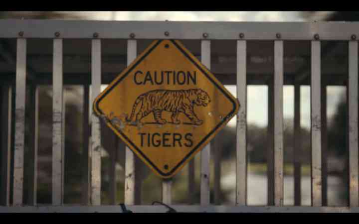 screenshot from Tiger King of a caution sign