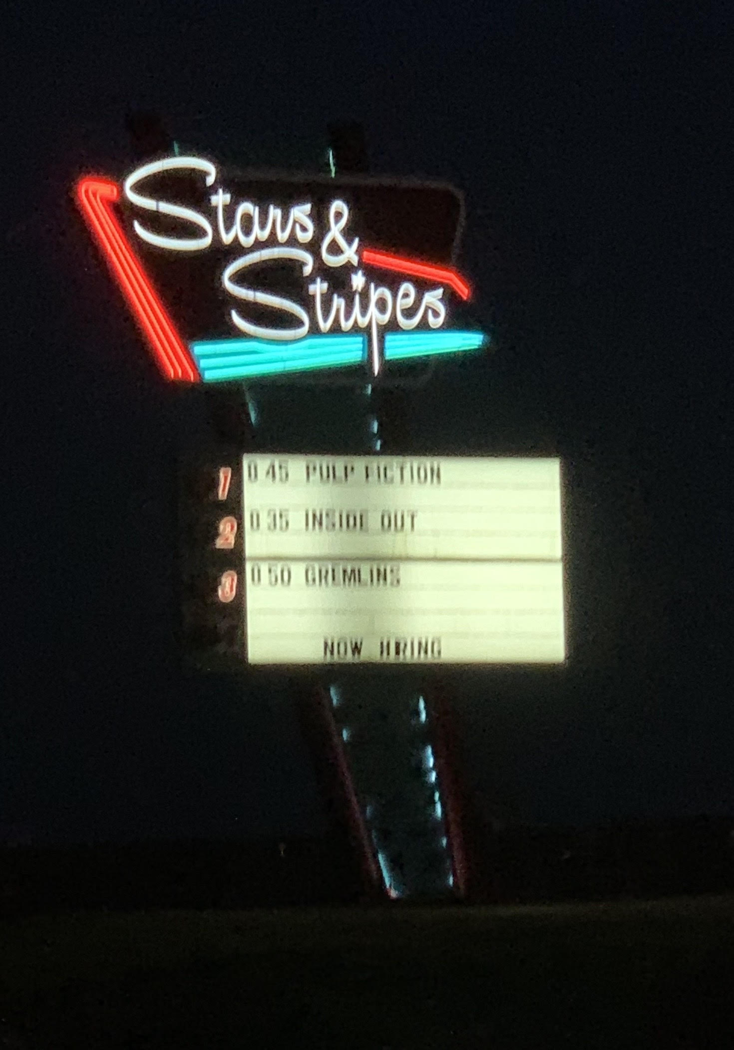 A giant neon sign at the entrance of Stars and Stripes