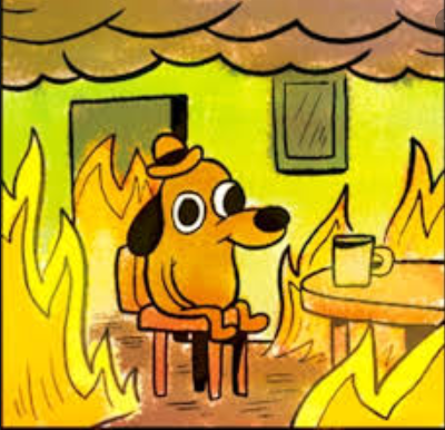 A dog with a hat sits at a table in an apartment that is engulfed in flames. Despite the chaos, the dog has a smile on his face and is sitting calmly.
