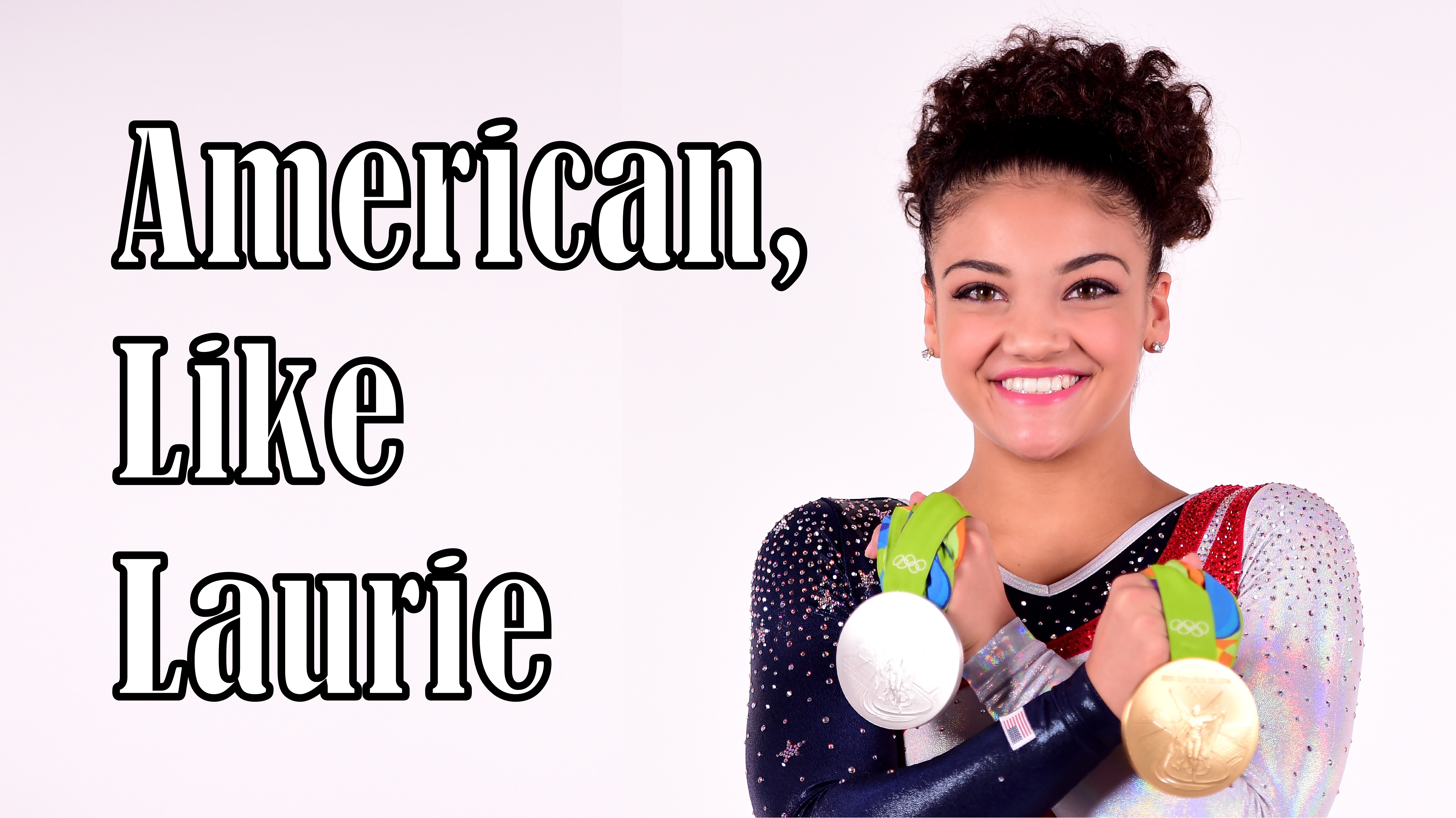 Laurie Hernandez poses with a gold and silver medal in front of a blank background that says American, Like Laurie