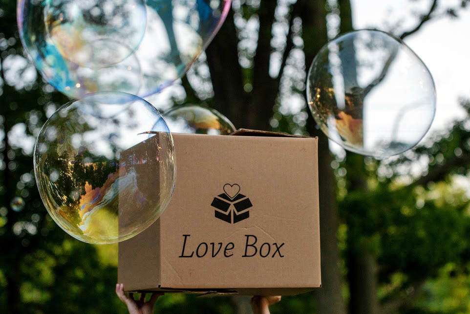 Image of the Love Box outdoors with bubbles that’s provided to foster care families by Austin Angels. 