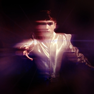 The album cover is a photo of Declan McKenna captured while he is spinning in a sparkly, retro-looking suit.