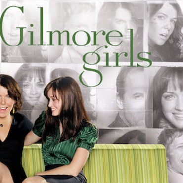 Netflix’s Gilmore Girls cover. Black and white background with multiple character faces behind the green words "Gilmore Girls" and a green couch where Lorelai and Rory Gilmore are sitting.
