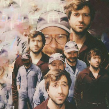 A collage of film photos of the singers in Penny and Sparrow. One man has a maroon shirt on and the other has a light blue shirt on with glasses and a baseball hat on. The photos fade into the top left corner of the album.
