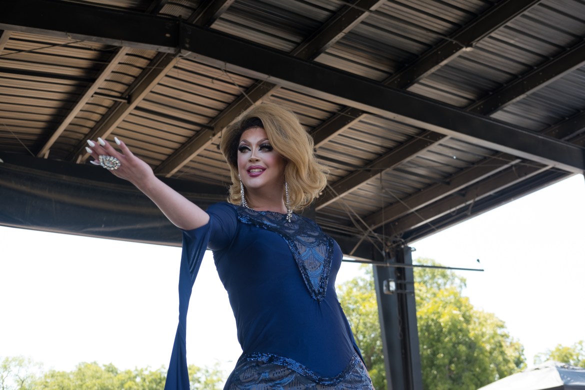 Drag queen paris van cartier reaching out to the crowd