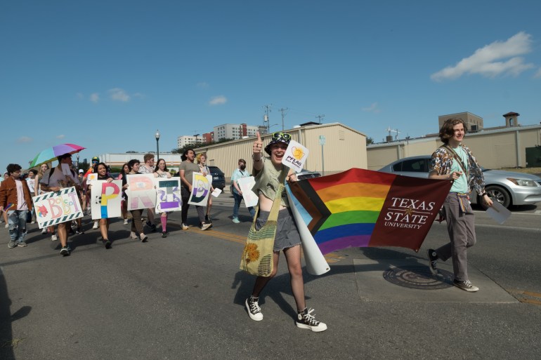 Texas State students and San Martians marching at the Loud & Proud Pride Fest.