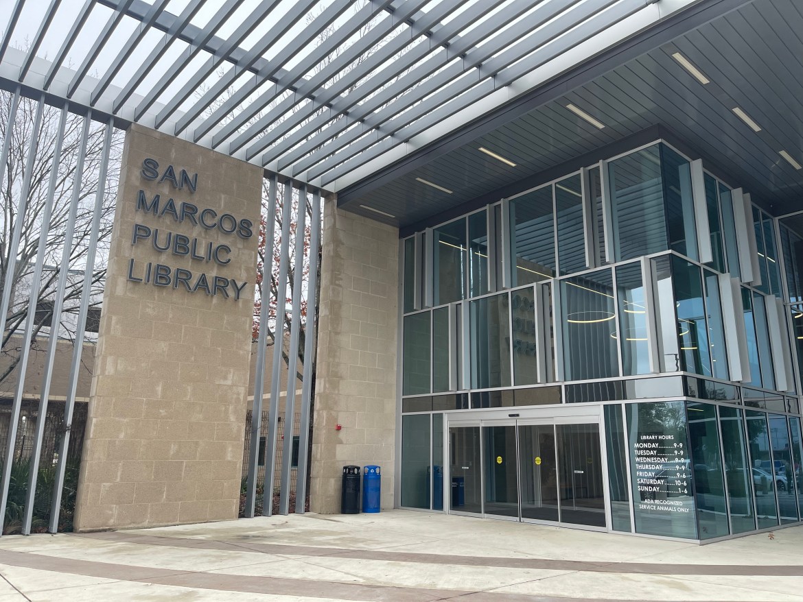 Outside the front entrance of the San Marcos Public Library building