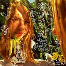 A woman looks into a mirror while she holds a warped yellow flower in her mouth