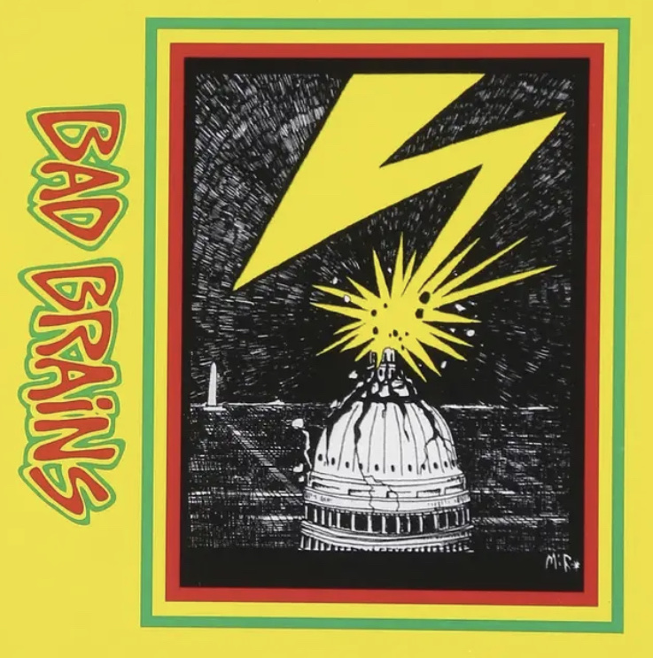 yellow border with "Bad Brains" in red font of left side. A lightning bolt is hitting the top of a dome building in the middle. 