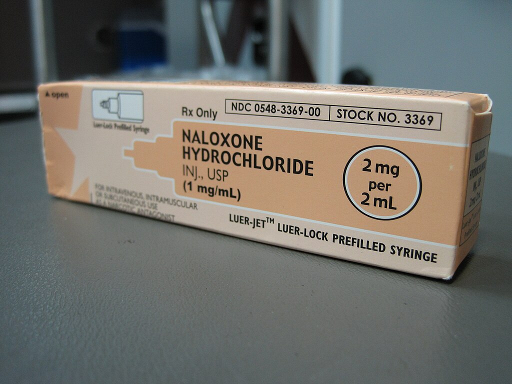 An orange box of Naloxone Hydrochloride Pre-filled Syringe .