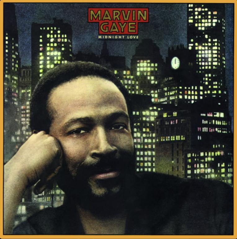 Marvin Gaye rests his head on his fist in front of a cityscape at night with Marvin Gaye and the album title in the top middle. There is a yellow border around the edge.