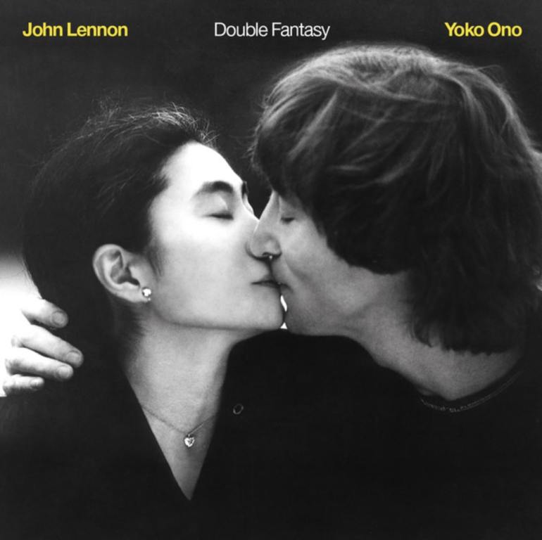 Black and white image of Yoko Ono and John Lennon kissing with their names in yellow font and album name center top of the cover.
