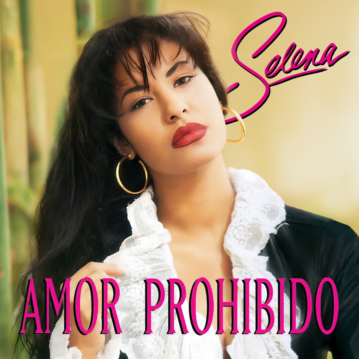 Album cover of Amor Prohibido by Selena. : A woman adjusts her collar as she poses in front of a simplistic background.