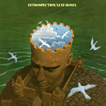 album cover green backdrop with someones top their head open with three white doves flying into his head which looks like the sky.