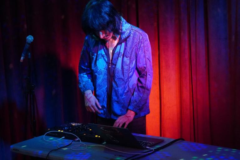 Glitcheo looking dapper while DJing at River Rave