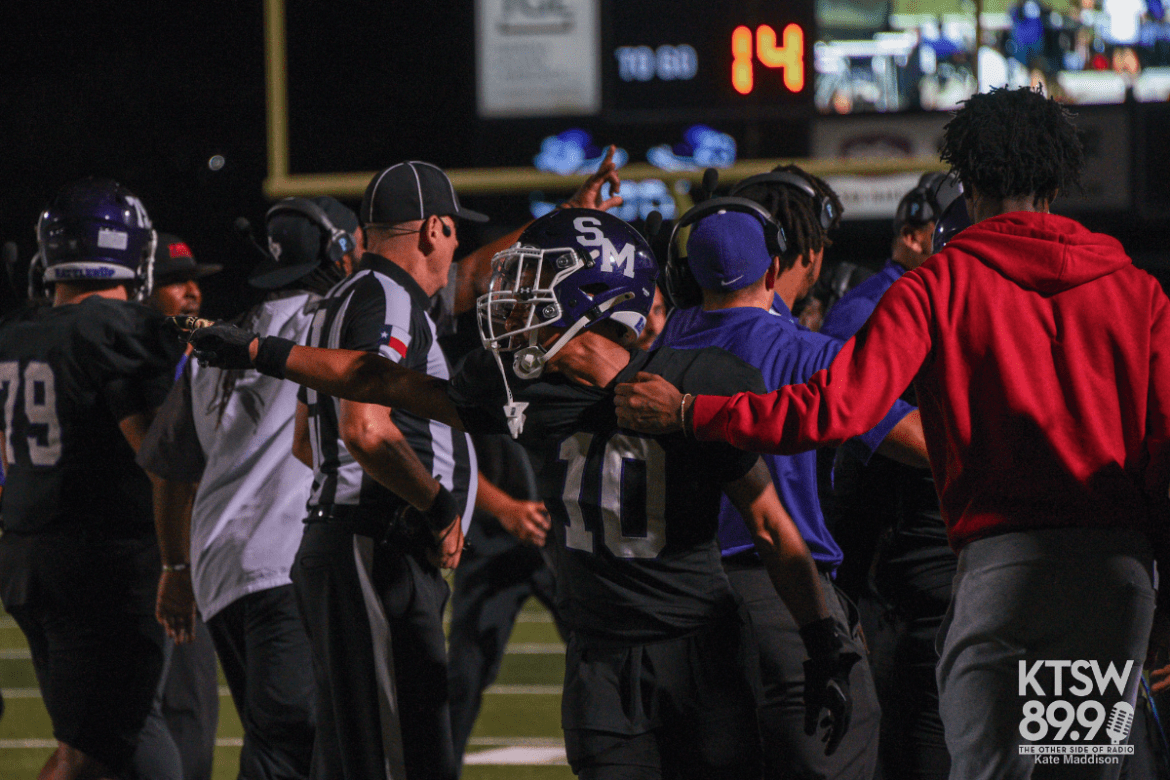 WR Legend Ramirez being held back by coaches on sideline