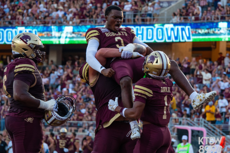 Jordan McCloud celebrates with offensive linemen following touchdown play | Kate Maddison