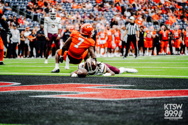 Kole Wilson on ground in front of end zone | Beau Kelly
