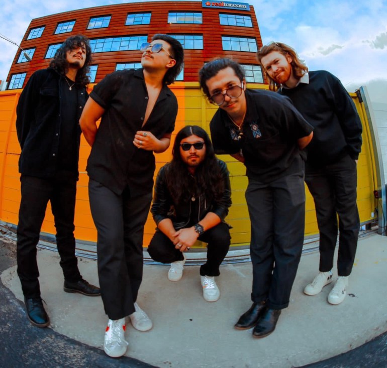 5 piece band Flight by Nothing, posing togehter in similar black outfits in fisheye lens