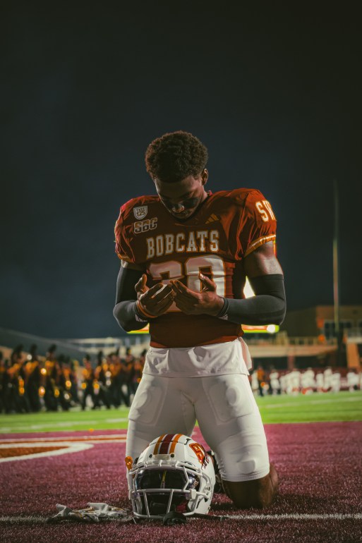 Texas State player praying before kick-off | Beau Kelly