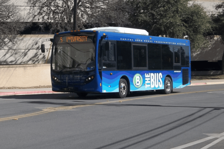 One public bus driving by.