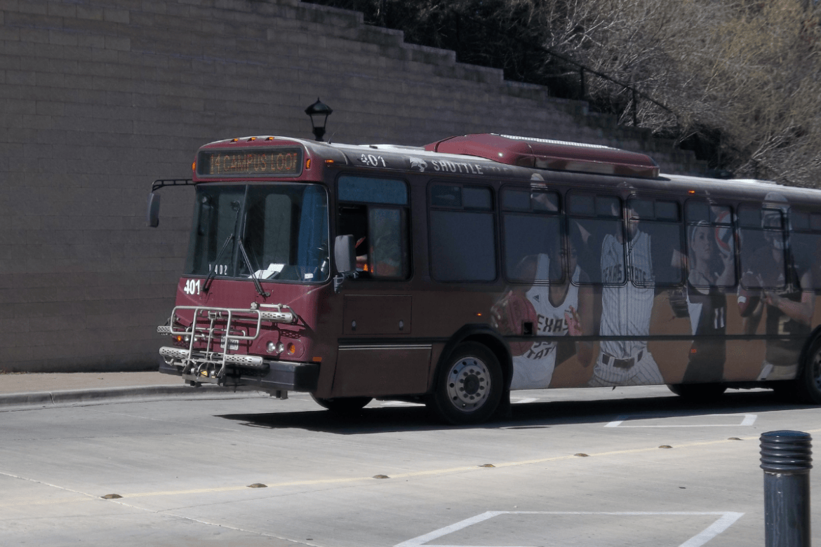 One TXST shuttle driving by.