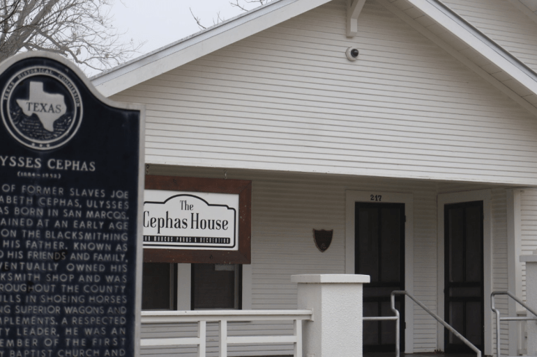 Historical marker with the Cephas house behind