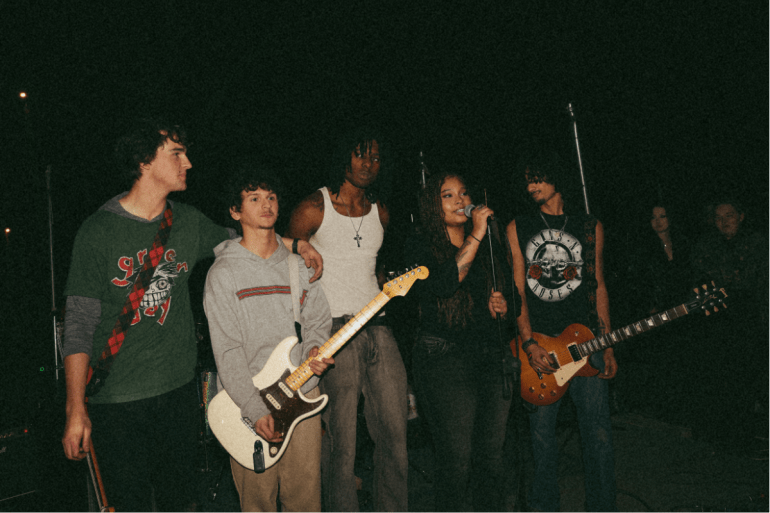 The Band True Status on stage giving a speech before they play