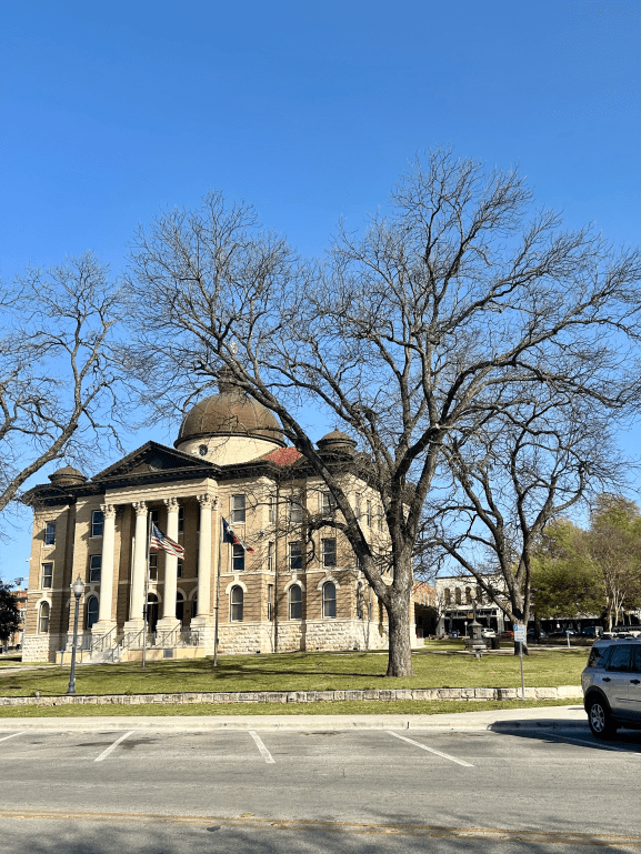 San Marcos town square with the Hays County Courthouse in the middle.