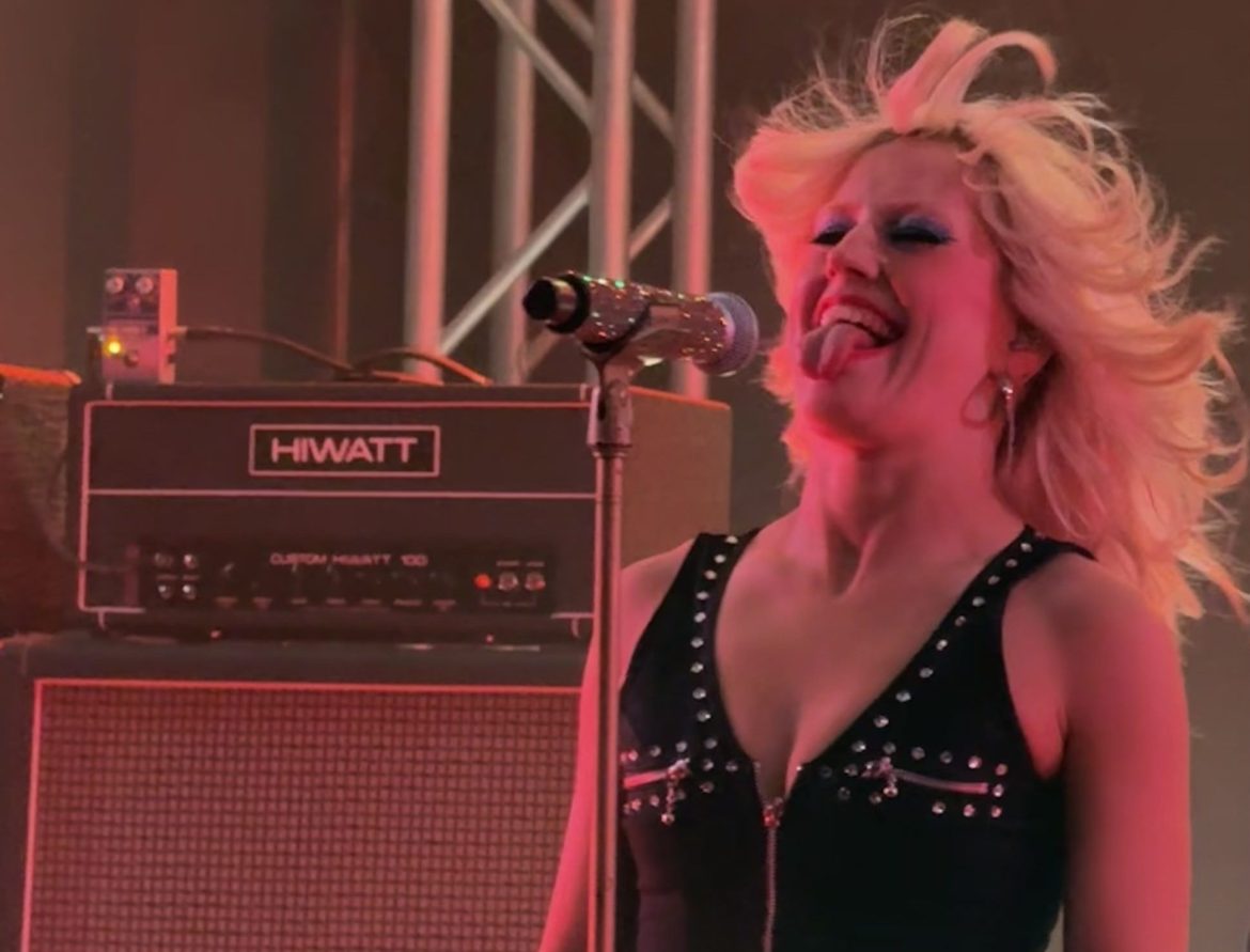 Amy Taylor of Amyl and The Sniffers sticking her tongue out.