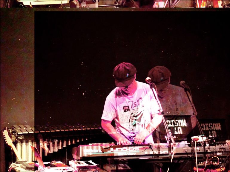 Matt Abajian is pictured playing a synth