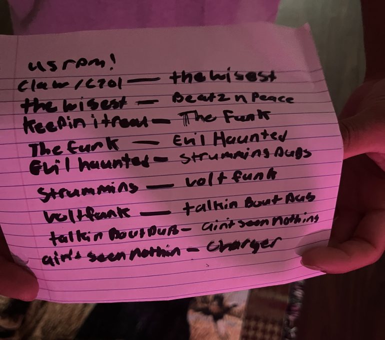 Handwritten setlist featuring 9 songs on the left that transition to another set of 9 songs for the performance. 