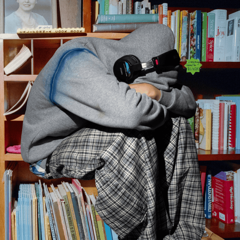 The album cover for Kevin Abstract's "Blush" features a close-up, slightly distorted image of a person's face. Their eyes are looking up and to the left, and a reddish "blush" is on their cheeks and nose.