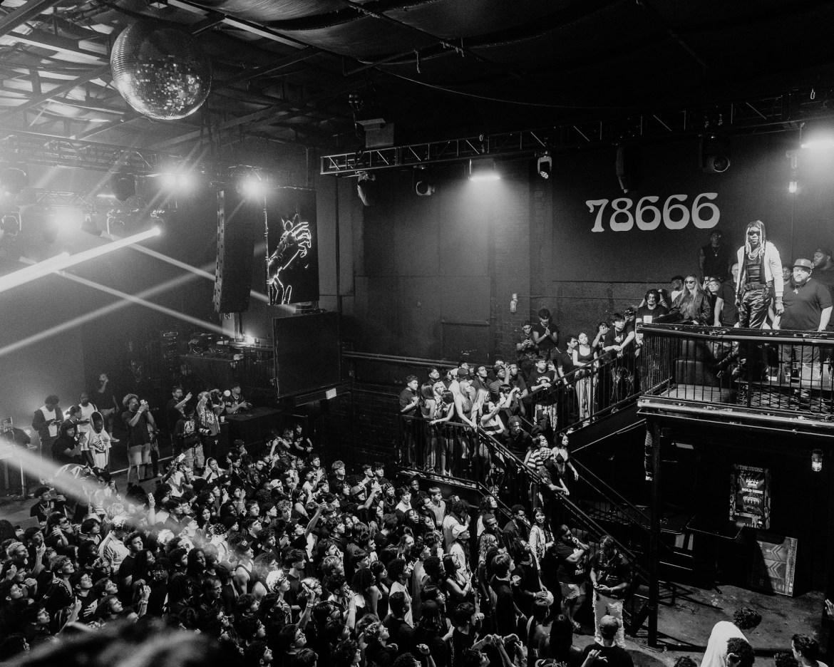 a full scale shot of the club location showing the size of the crowd for a listening party