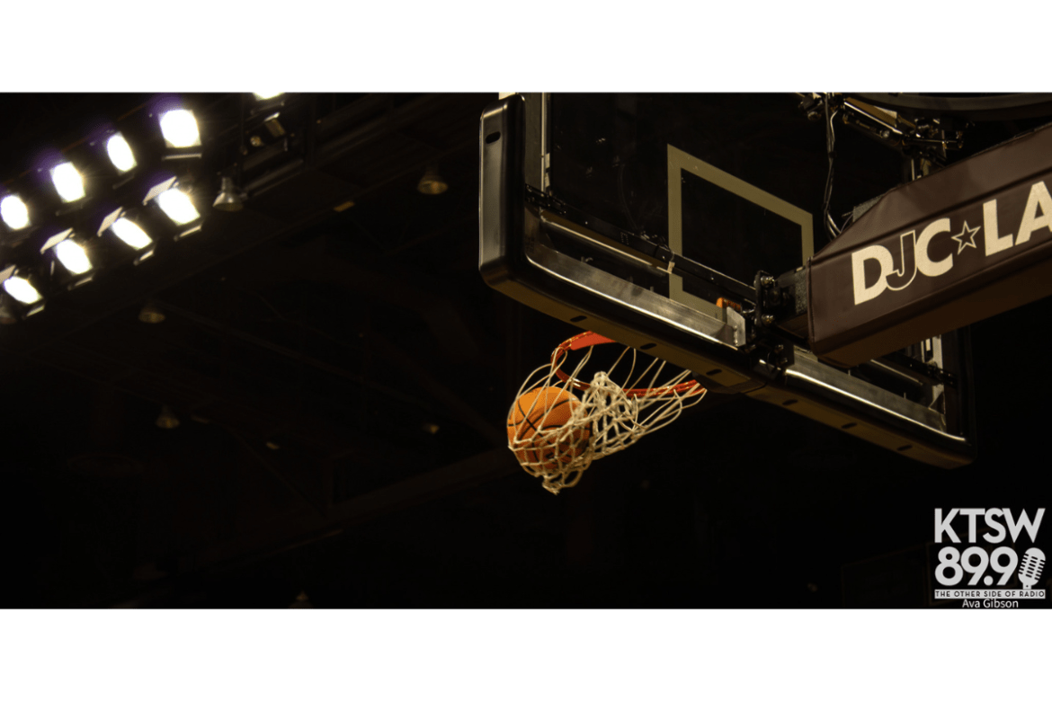 A basketball falls through the hoop.